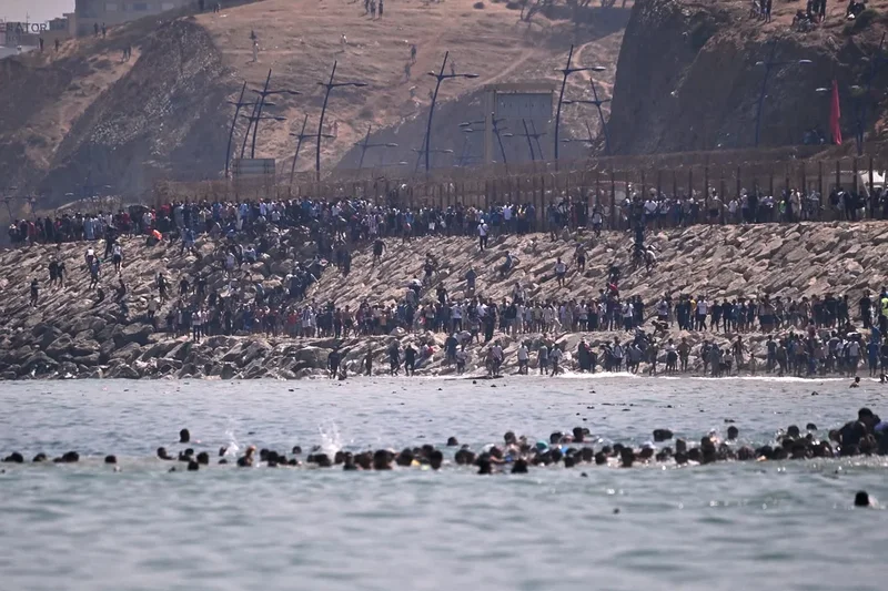 Nine deaths in Ceuta as thousands of migrants breach Morocco’s border with Spain