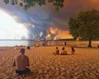 France and Spain race to control wildfires as 200,000 flee – live