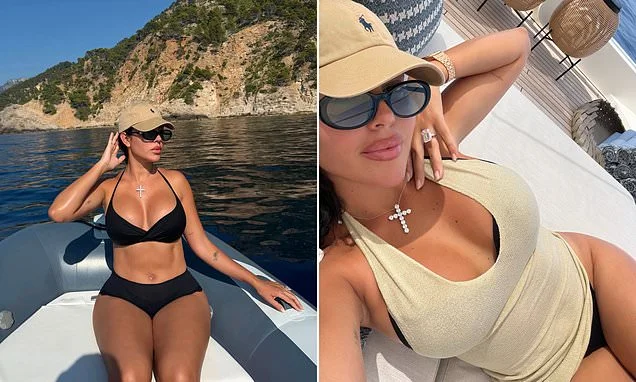 Georgina Rodriguez shows off her incredible curves in a black bikini as she makes pointed reference to her huge diamond engagement ring ahead of 'wedding' to Cristiano Ronaldo
