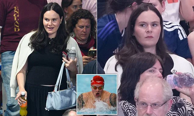 Pregnant Holly Ramsay takes a seat in the stands to watch husband Adam compete in the 100m breaststroke at the Commonwealth Games as he bags a place in the final