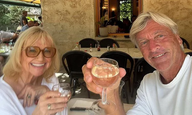 Where IS Judy Finnigan? As pictures emerge of her drinking with husband Richard Madeley, friends tell KATIE HIND the real reason she's disappeared from TV - and why she's now keeping the man eight years her junior on a VERY tight leash