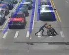Driver dressed as Spider-Man helps man in wheelchair cross road – video