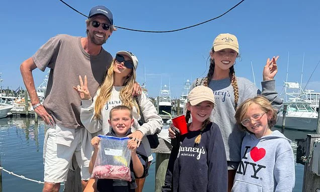 Abbey Clancy and husband Peter Crouch enjoy a chaotic fishing trip with their lookalike four children