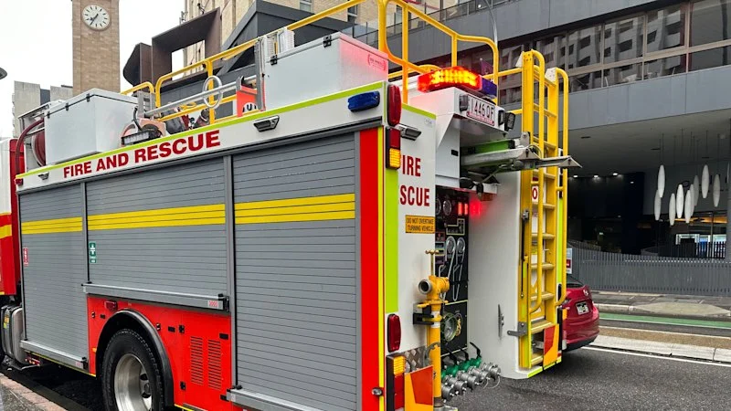 University evacuates as car fire spreads to bush in Brisbane’s south