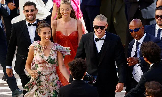 Erling Haaland leads party-goers in Norway's iconic rowing celebration as he joins Man City stars at team-mate's glamorous Italian wedding