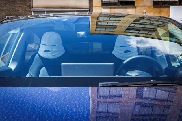 Can everyone please stop buying those balaclava headrests for their cars?