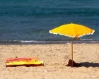 Umbrellas and deck chairs seized in crackdown on reserving beach spots in Naples