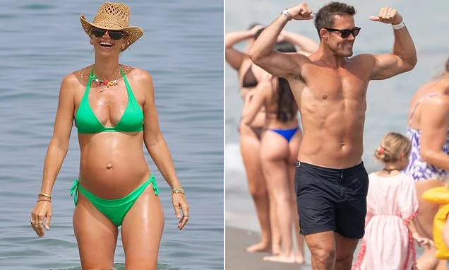 Pregnant Vogue Williams shows off her bump in a green bikini as husband Spencer Matthews flexes his muscles during family beach day in Spain