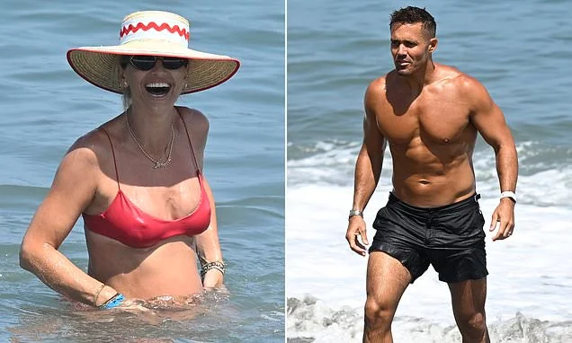 Pregnant Vogue Williams giggles in a raspberry red bikini as she hits the sea with shirtless husband Spencer Matthews in Marbella