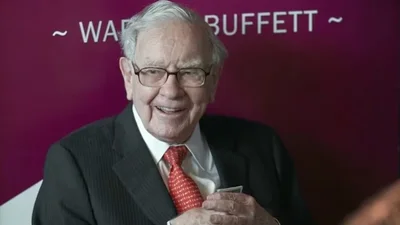 Who does Warren Buffett credit for his extraordinary success?