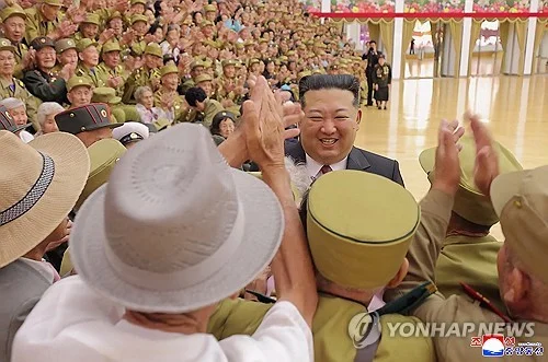 N. Korea's Kim takes photos with war veterans to celebrate armistice anniversary