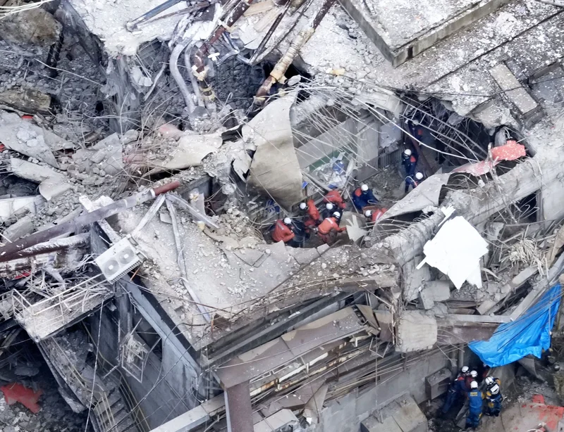 Japan scrambles to rescue victims of earthquake that killed 13