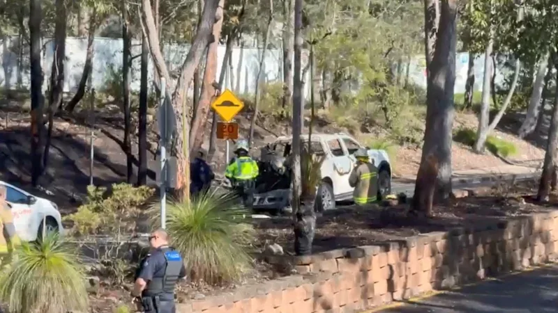 University evacuates as car fire spreads to bush