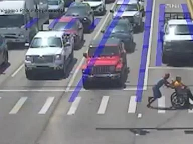 WATCH:  Real-life Spider-Man jumps into action to help man cross busy intersection