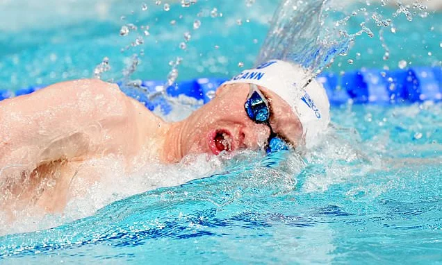 Sean McCann is cheered on by proud parents Kate and Gerry as he swims in Commonwealth 400m freestyle final two decades after older sister Maddie vanished