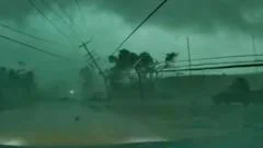 Dashcam captures tornado toppling power lines onto car