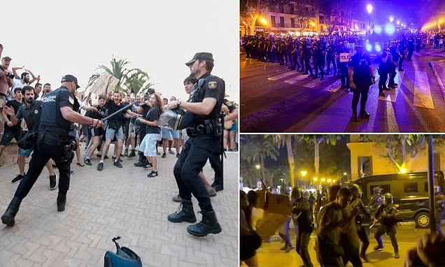 Armed riot police with shields clash with anti-tourism protesters in Mallorca as demonstrations turn violent