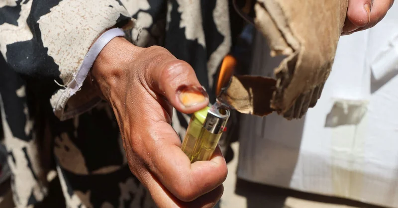 In Gaza's tent camps, a cigarette lighter becomes a lifeline