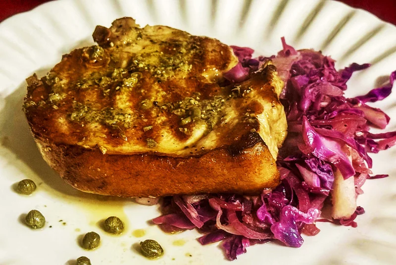 WHAT’S COOKING: Pork T-bone with caper butter and braised red cabbage and pears