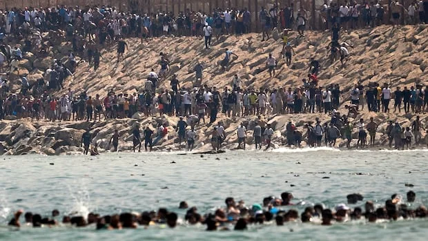 'Absolute chaos' as thousands of Moroccan migrants breach Spain's Ceuta border