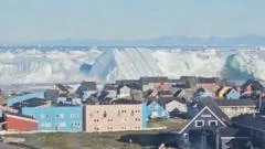 Watch: Giant iceberg turns over near  Greenland's coast