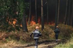 France fire crews face searing heat in battle to contain flames