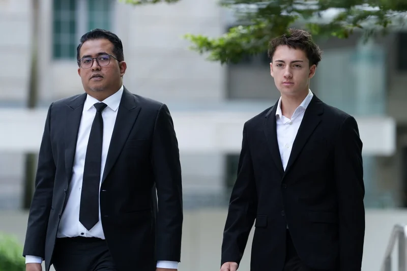 French student pleads guilty and is fined for a straw-licking stunt in Singapore
