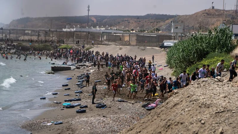Hundreds of migrants flood into Spain's Ceuta exclave from Morocco