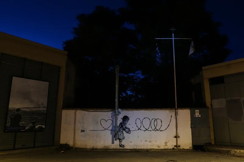 A wall through Nicosia reflects the decades-old ethnic divide in Cyprus, in photos