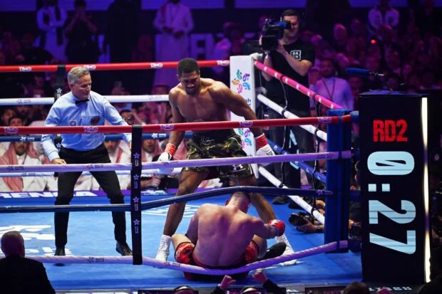 Anthony Joshua recovers to stop Kristian Prenga in round 2