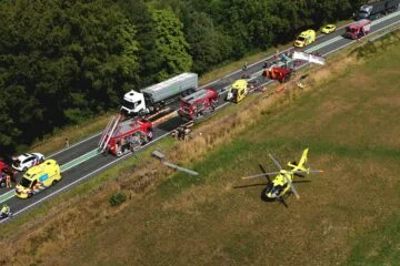 One person dies, six injured in crash between lorry and minibus