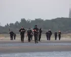 Footage shows French police clashing with people on beach as they try to leave in small boat