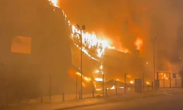 Moment huge blaze rips through fashion outlet which makes suits for Premier League footballers