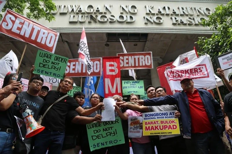 Labor groups: Lift wage hike injunction