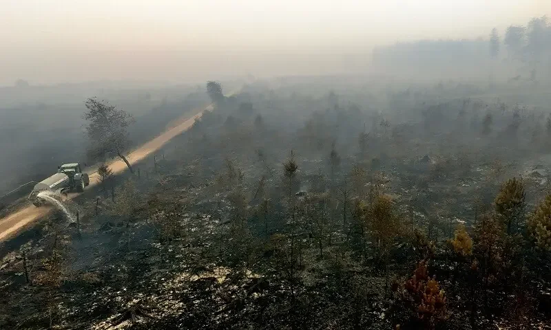 Farmers, helicopters help battle record Belgian wildfire