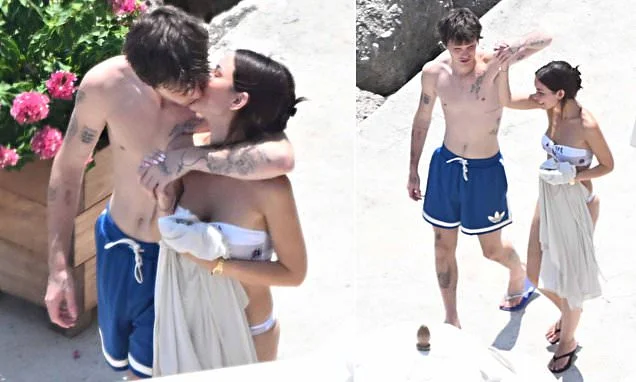 Cruz Beckham, 21, plants a passionate kiss on his bikini-clad girlfriend Jackie Apostel, 30, as they soak up the sun during family trip to the Amalfi Coast