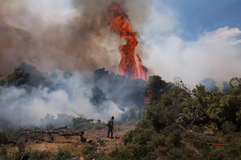 Two die as firefighting helicopters collide in Greece; French blaze changes course