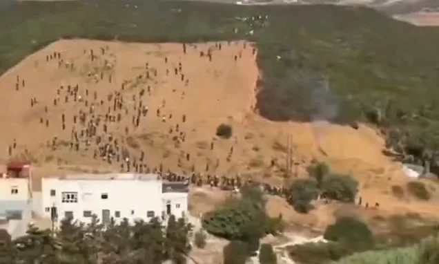 Moment hundreds of migrants try to storm Ceuta in second 'invasion' attempt before being beaten back and arrested by riot police