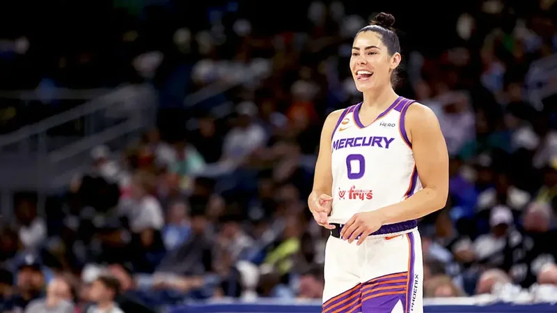 Social media explodes as WNBA star Kelsey Plum leaps into the arms of opposing coach during play
