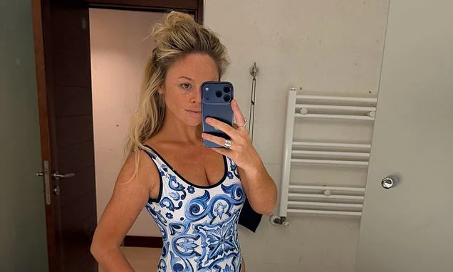 Emily Atack shows off her figure in a blue swimsuit during a couple of days of 'tapas and tantrums' with her fiance Alistair Garner and their son Barney