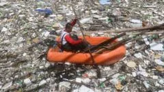 Watch: Tide of rubbish blankets Philippines river