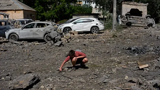 Kyiv residents search through the wreckage after Russia’s deadly barrage