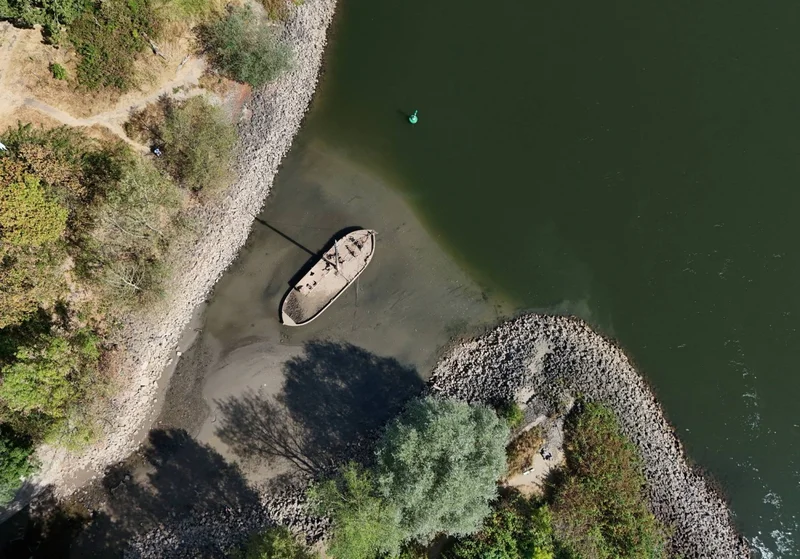 Low water levels on Germany’s Rhine amid heat and drought threaten economic blow