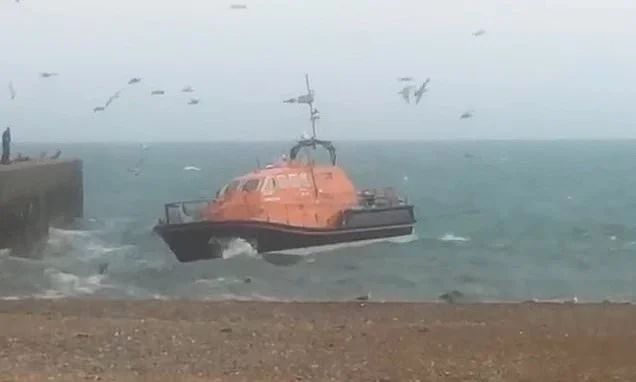 Family who drowned off Sussex beach were a Palestinian refugee, his wife and daughter - as video shows moment lifeboat battled heavy seas in desperate search for victims