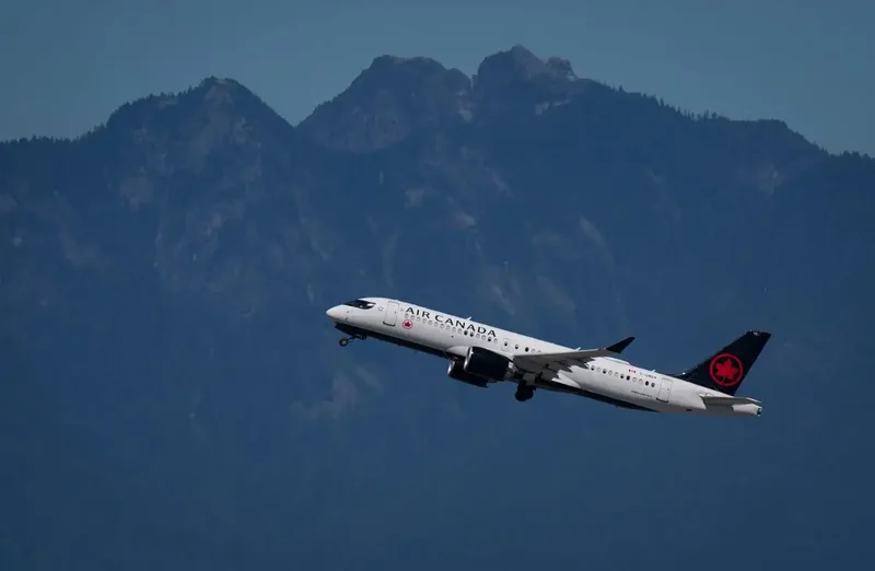 Air Canada says fuel costs spiked 49% from last year, with travel demand up