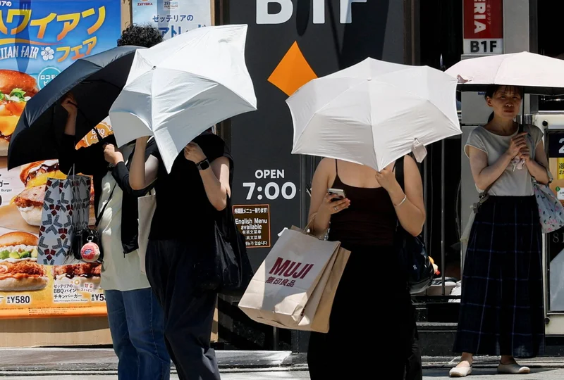 AC vests and UV parasols: East Asia deploys heat-fighting gadgets