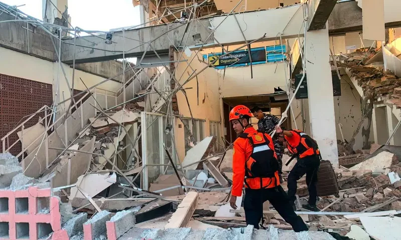 Indonesian rescuers search for survivors as 7.7 quake death toll rises to 38