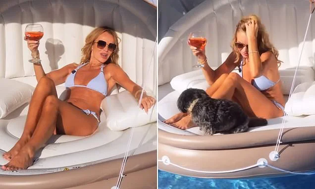 Bikini-clad Amanda Holden lounges on a sunbed sipping a cocktail as she films a dog food advert with her pets