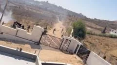 Israeli settlers besieging Palestinian families in West Bank village