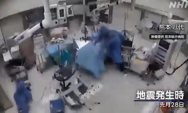 Moment Japanese surgeons cling to patient in operating theatre as 7.1 magnitude earthquake hits